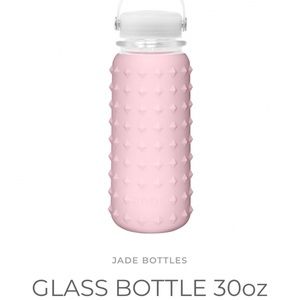 Pink glass water bottle with rubber sleeve